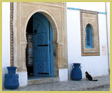 Decorative Arab-style doors and windows are a feature of the historic medina of Kairouan UNESCO world heritage site (Tunisia)